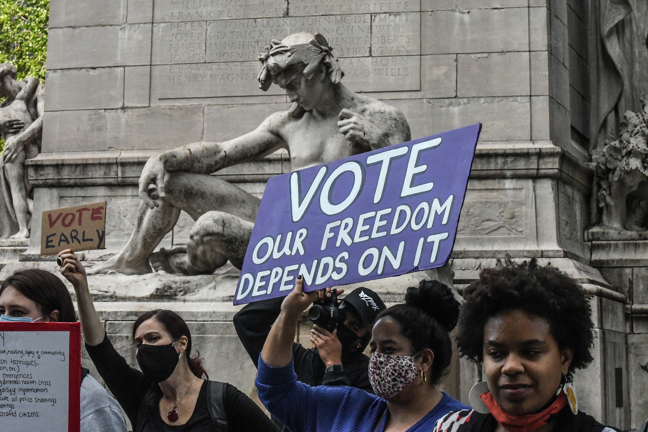 NEW YORK, NY - OCTOBER 24: People attend a March to the Polls rally in Columbus Circle during early voting for the U.S. Presidential election on October 24, 2020 in New York City. Due to the coronavirus and social distancing concerns New York State is all